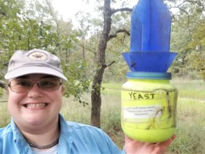 Agrilife Extension employee selfie with wasp collecting research equipment